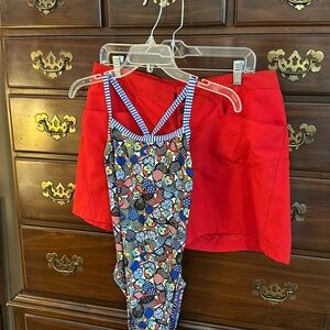 Patriotic swimsuit, matching red shorts.